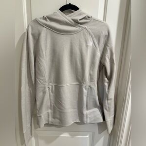 The North Face Women's off white Hoodie size medium with zippered pockets